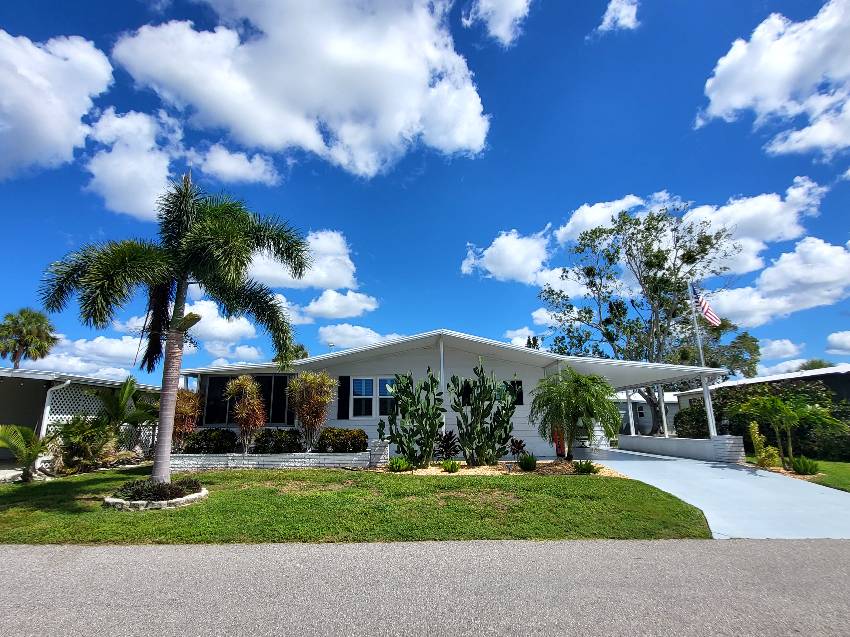 Sarasota, FL Mobile Home for Sale located at 5675 Halifax Drive Camelot Lakes Village