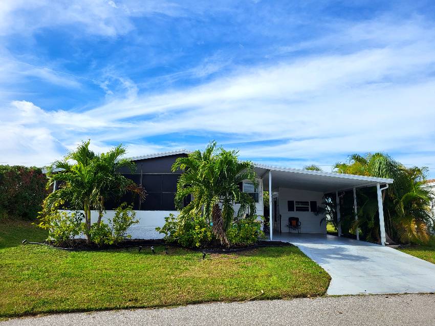 Sarasota, FL Mobile Home for Sale located at 5688 Halifax Drive Camelot Lakes Village