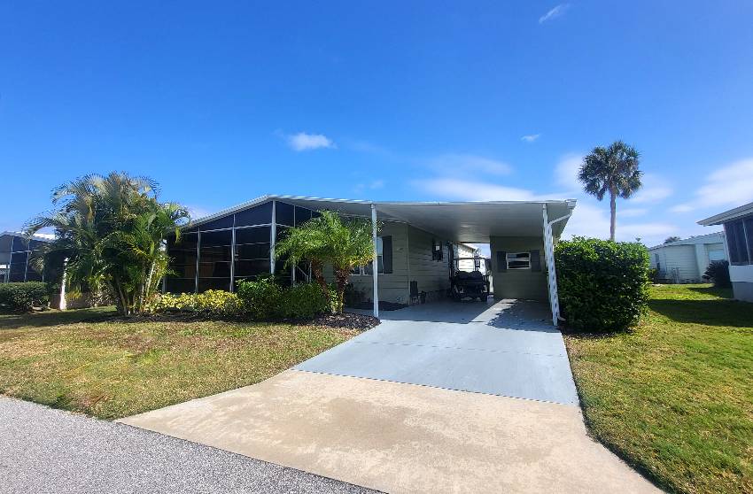 Sarasota, FL Mobile Home for Sale located at 5659 Halifax Drive Camelot Lakes Village