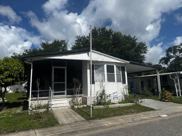 Clearwater, FL Mobile Home for Sale located at 15666 49th Street N #1097 Shady Lane Village