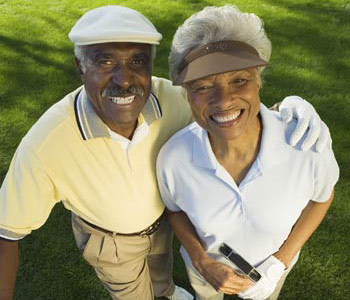 happy seniors playing golf