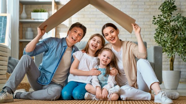 Happy family in a living room of mobile home