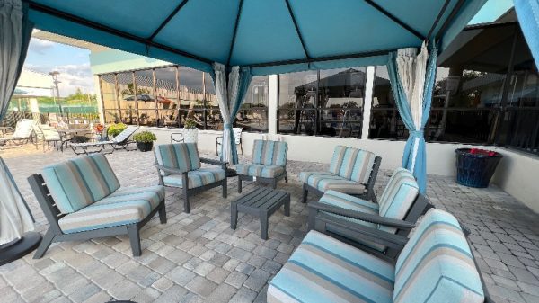 Mobile home community patio with blue chairs