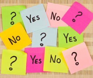 post it notes in pink yellow and blue with yes no and question parks 