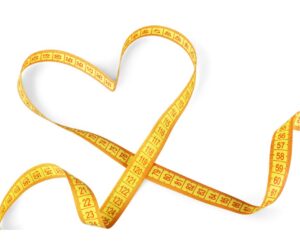 yellow measuring tape in the shape of a heart