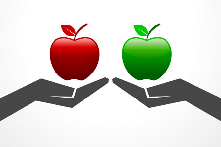 Comparison concept of a red apple and a green apple